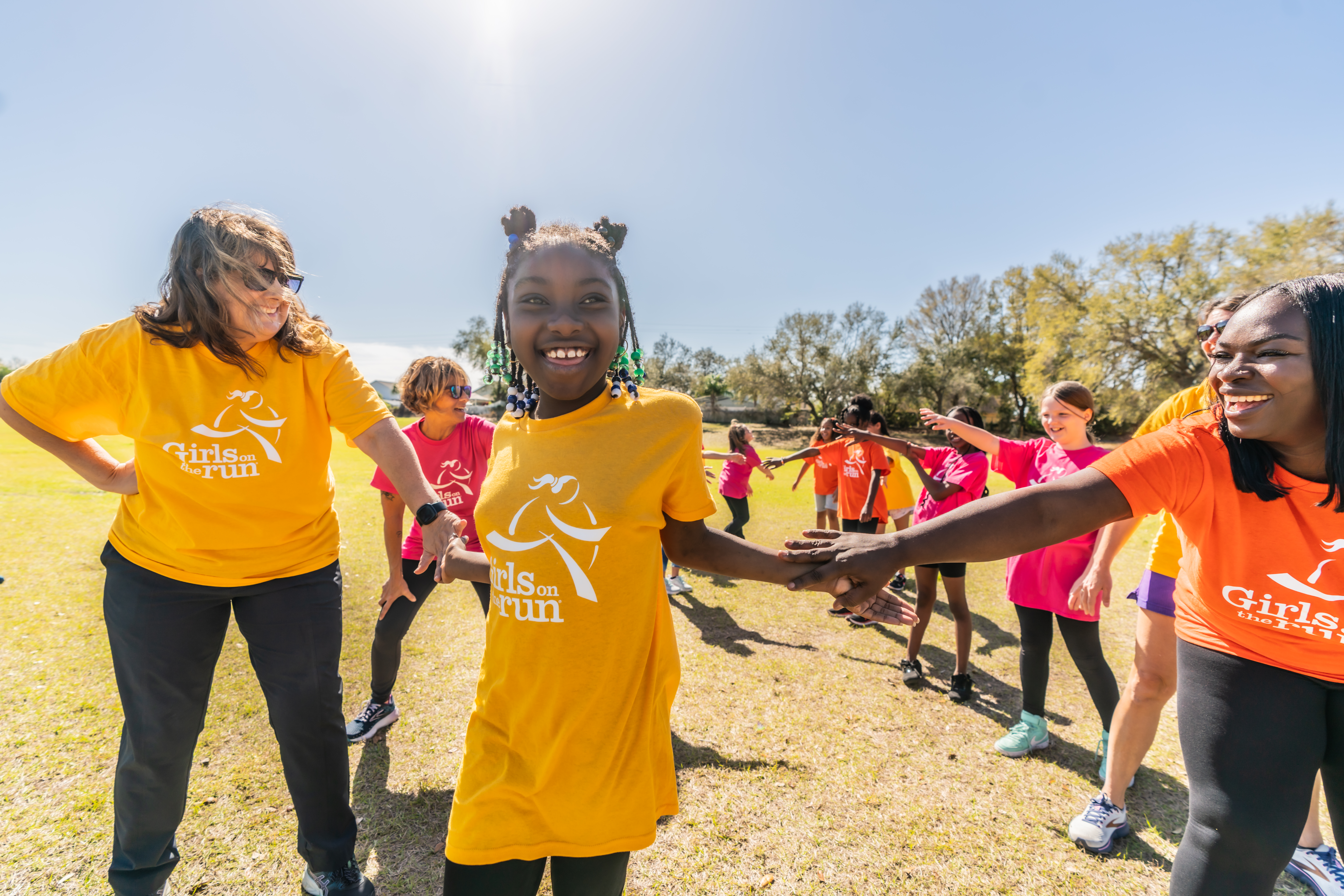 Girls on the Run girls running and celebrating